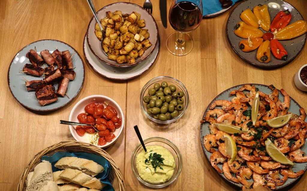 Traditional Spanish tapas and shared meals highlighting similarities between Spain and the United States culture of social dining.