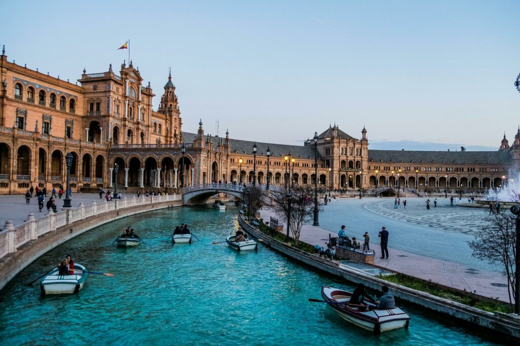 People on Boats near Residence in Seville, Spain