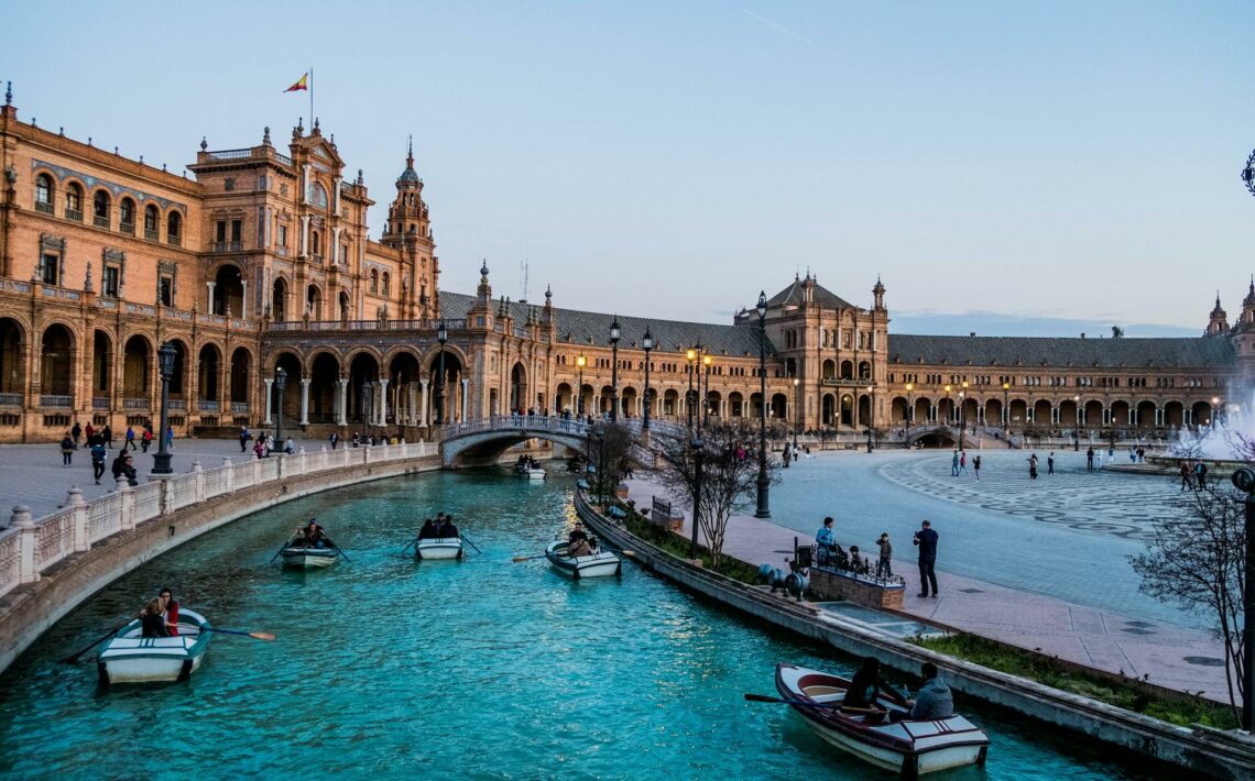 People on Boats near Residence in Seville, Spain